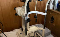 Slit lamp with mechanical table